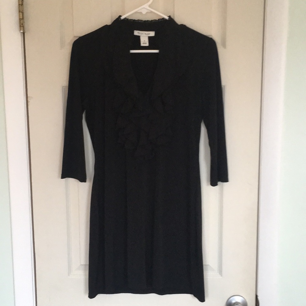 Black dress with ruffle front.